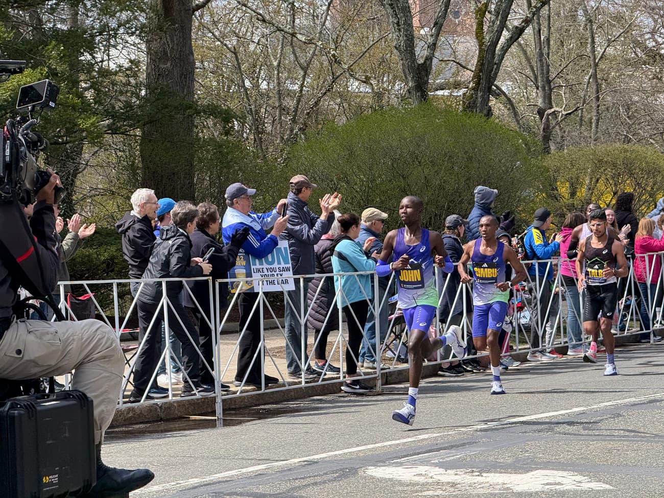 John Korir, Alphonce Simbu and Zouhair Talbi leading the men's field near Walnut Street in Newton