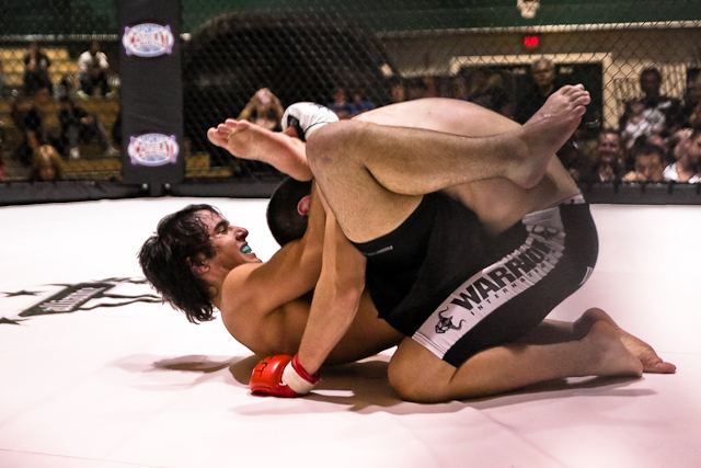 An MMA fight in a cage